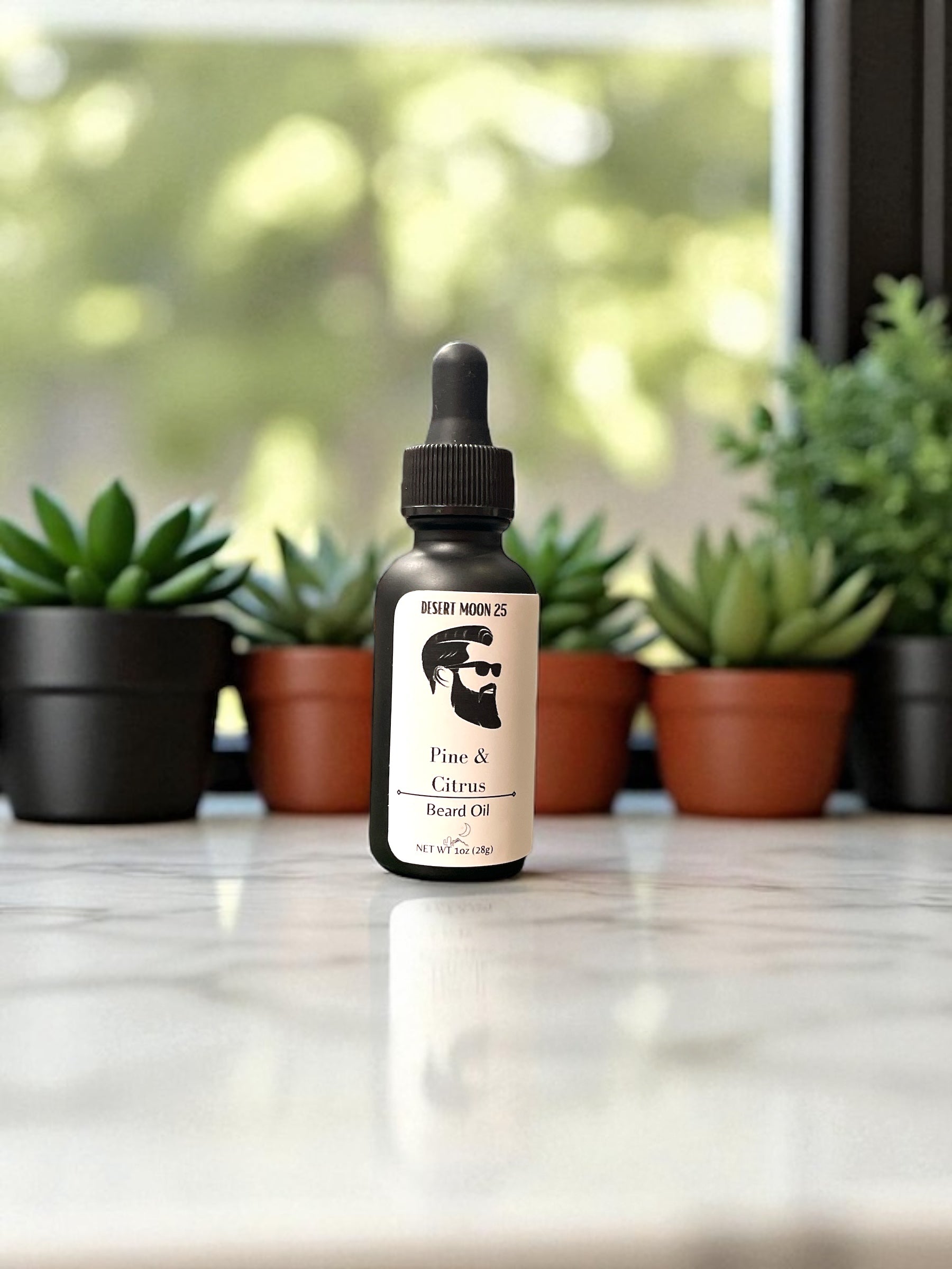 Bottle of beard oil with a dropper on a surface with plants in the background